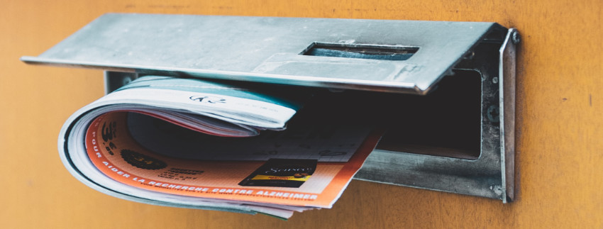 Business leaflet ads posted through a letterbox